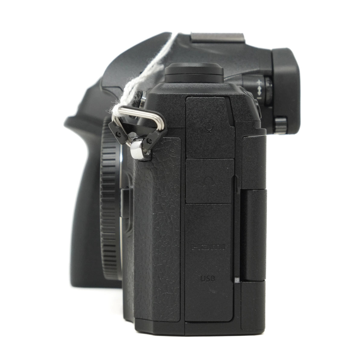 Side view of a black camera body on a white background