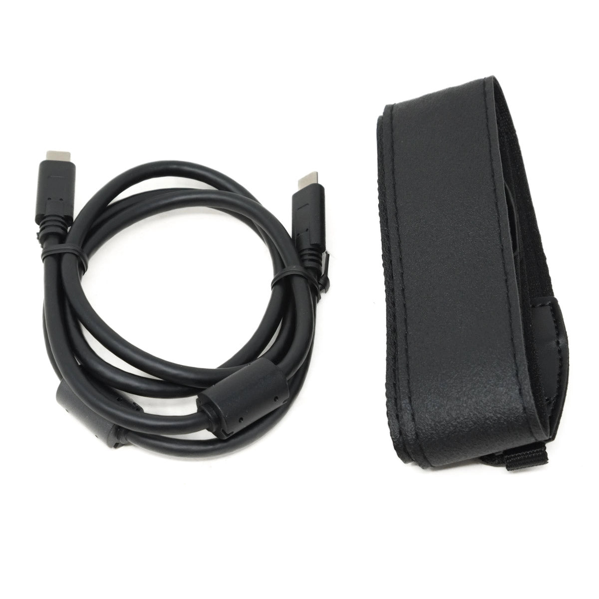 Black cable and black strap on a white background