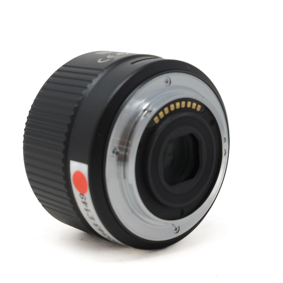 Camera lens with black and silver design on a white background