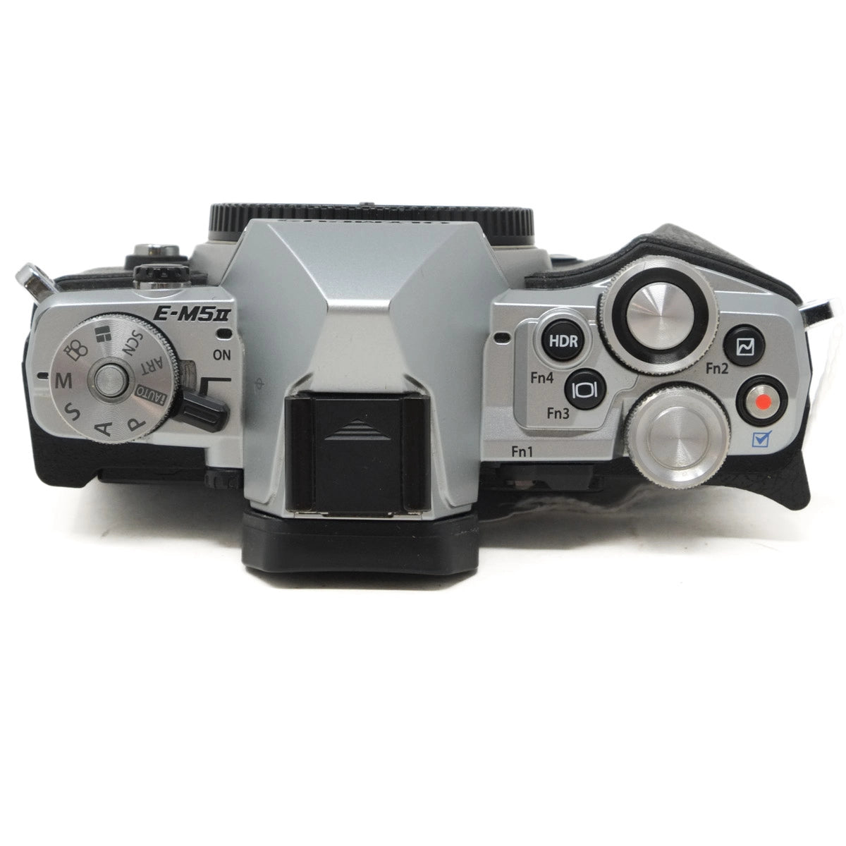 Camera body with control dials and buttons on a white background