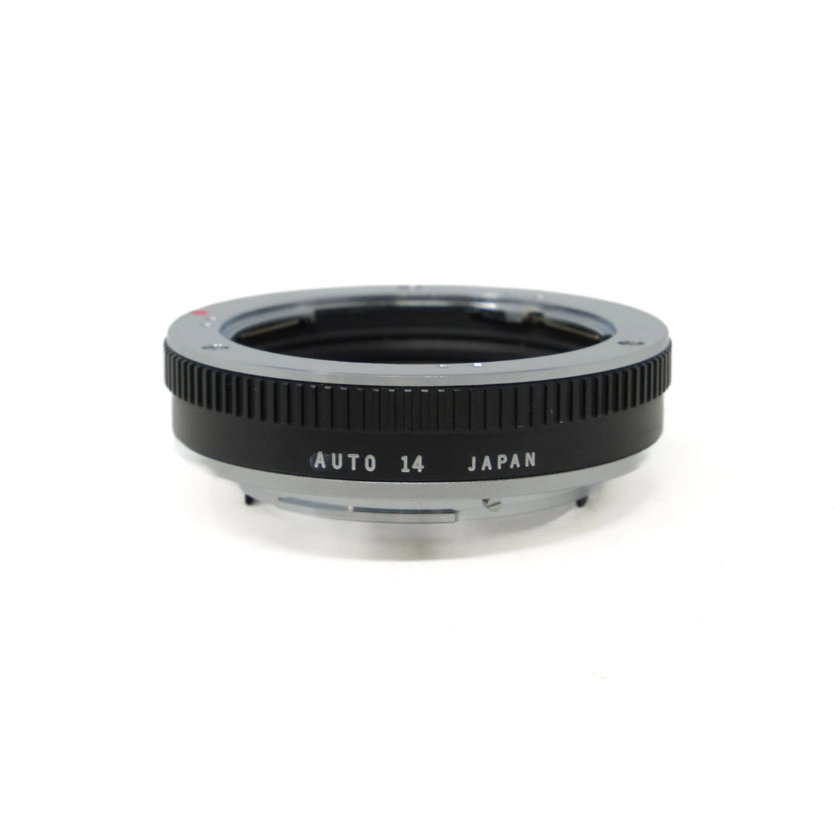 Camera lens extension tube with 'AUTO 14 JAPAN' text on a white background