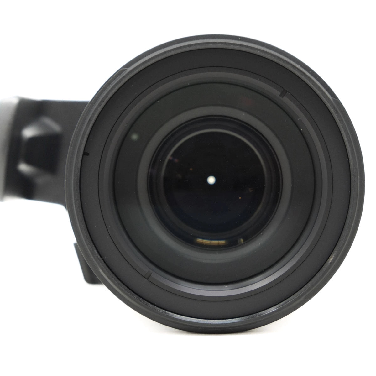 Close-up of a black camera lens on a white background