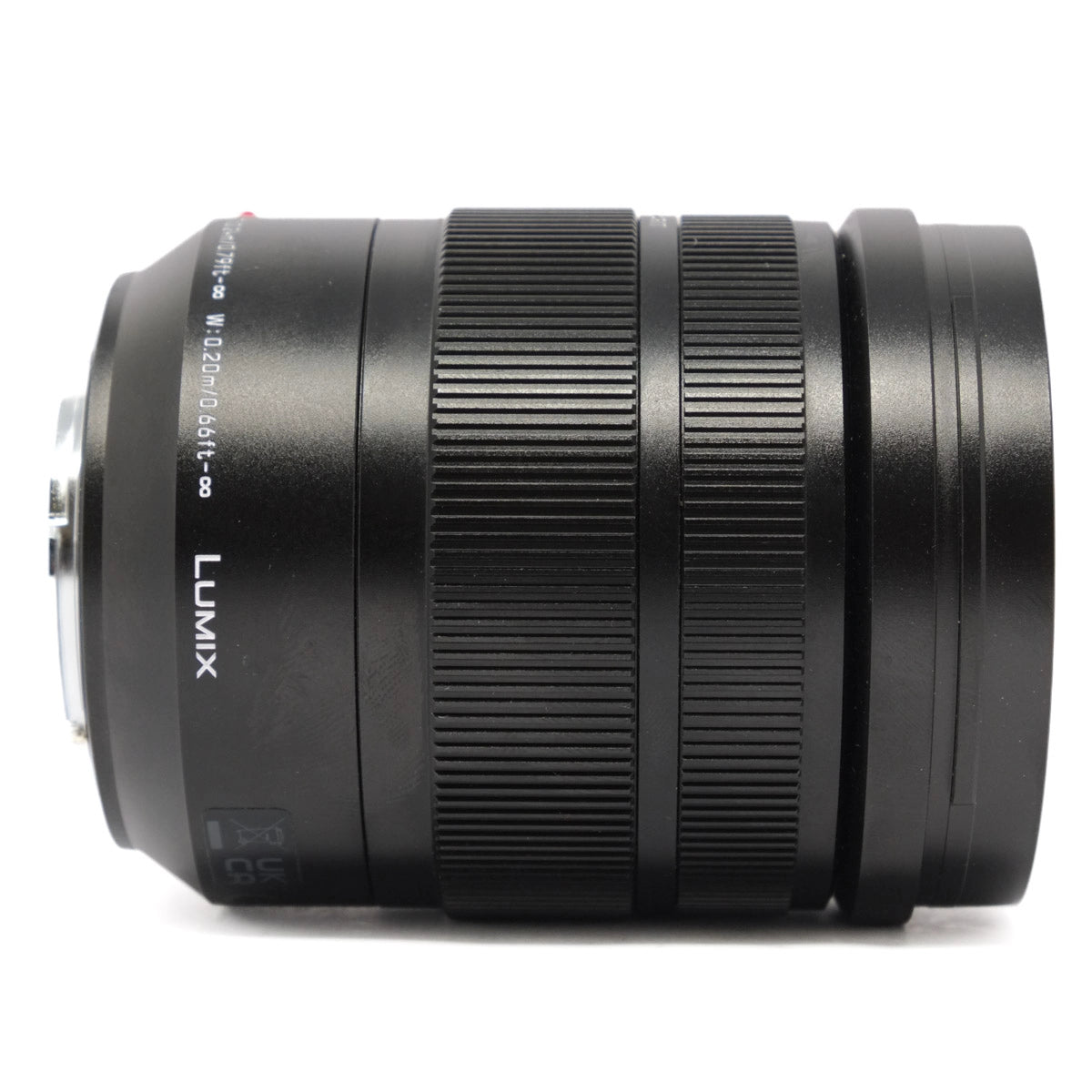 Black camera lens with 'LUMIX' branding on a white background