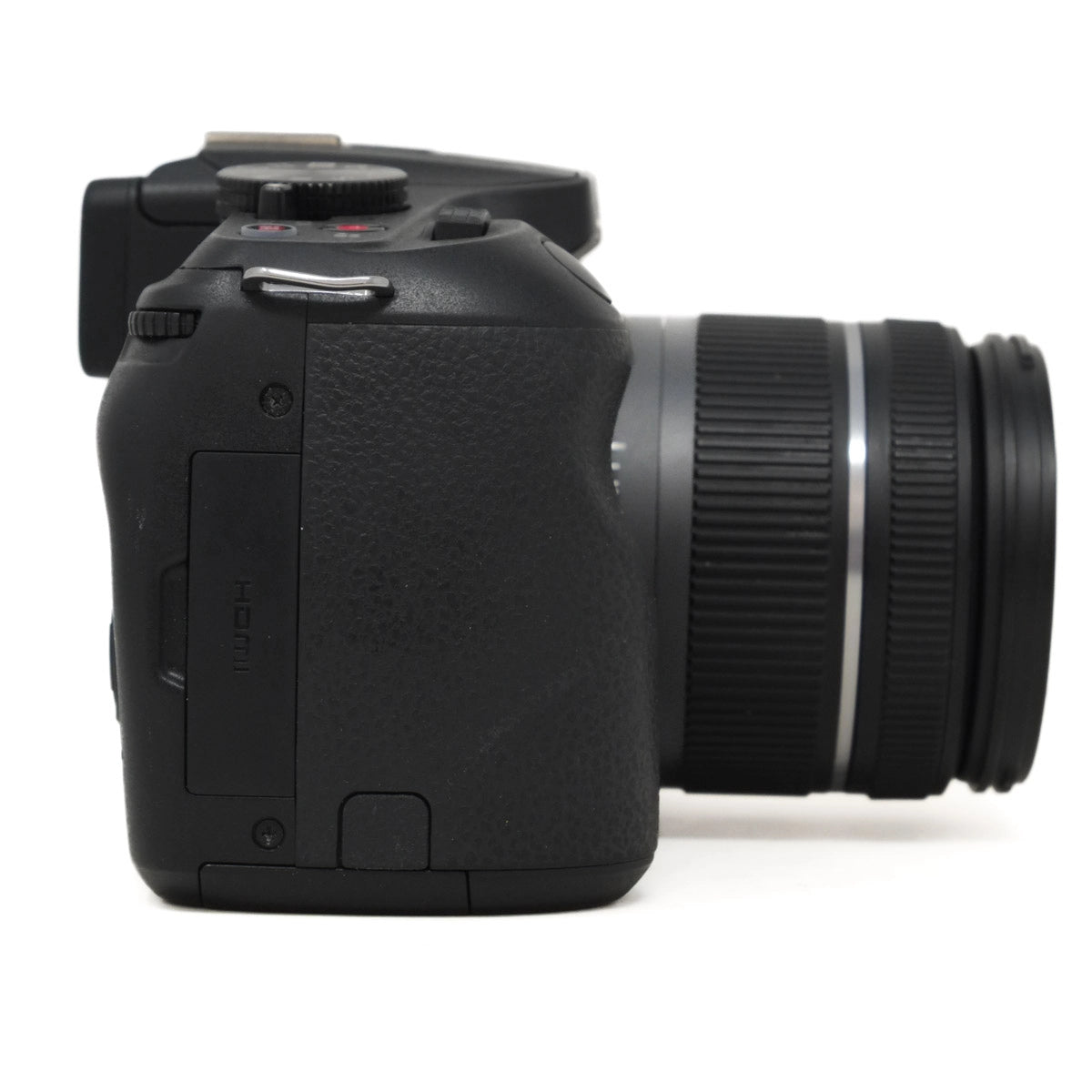 Black camera with lens on a white background