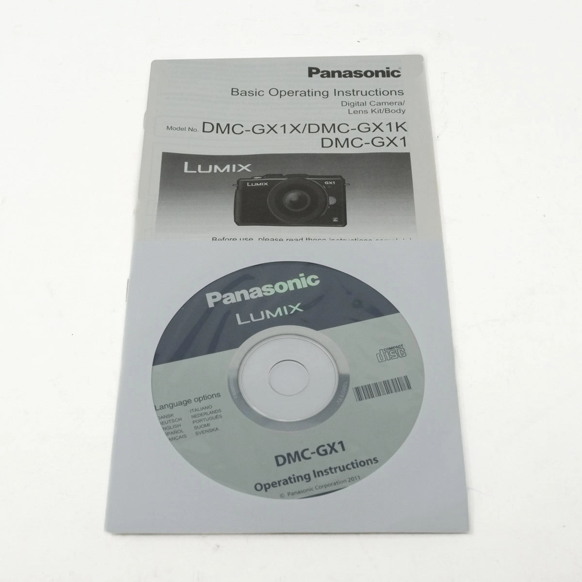 Panasonic Lumix camera operating instructions manual with CD on a white background