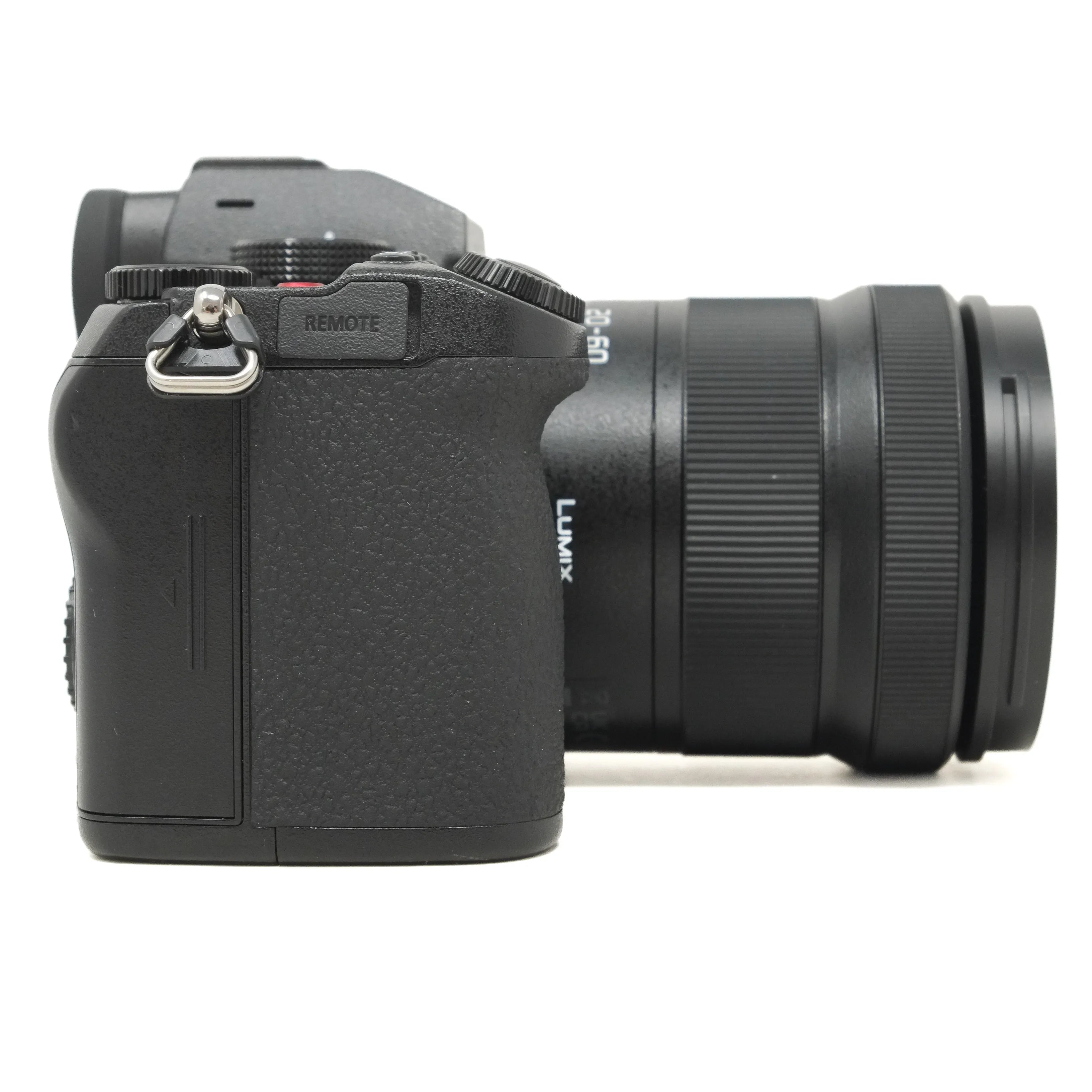 Black camera with lens on a white background