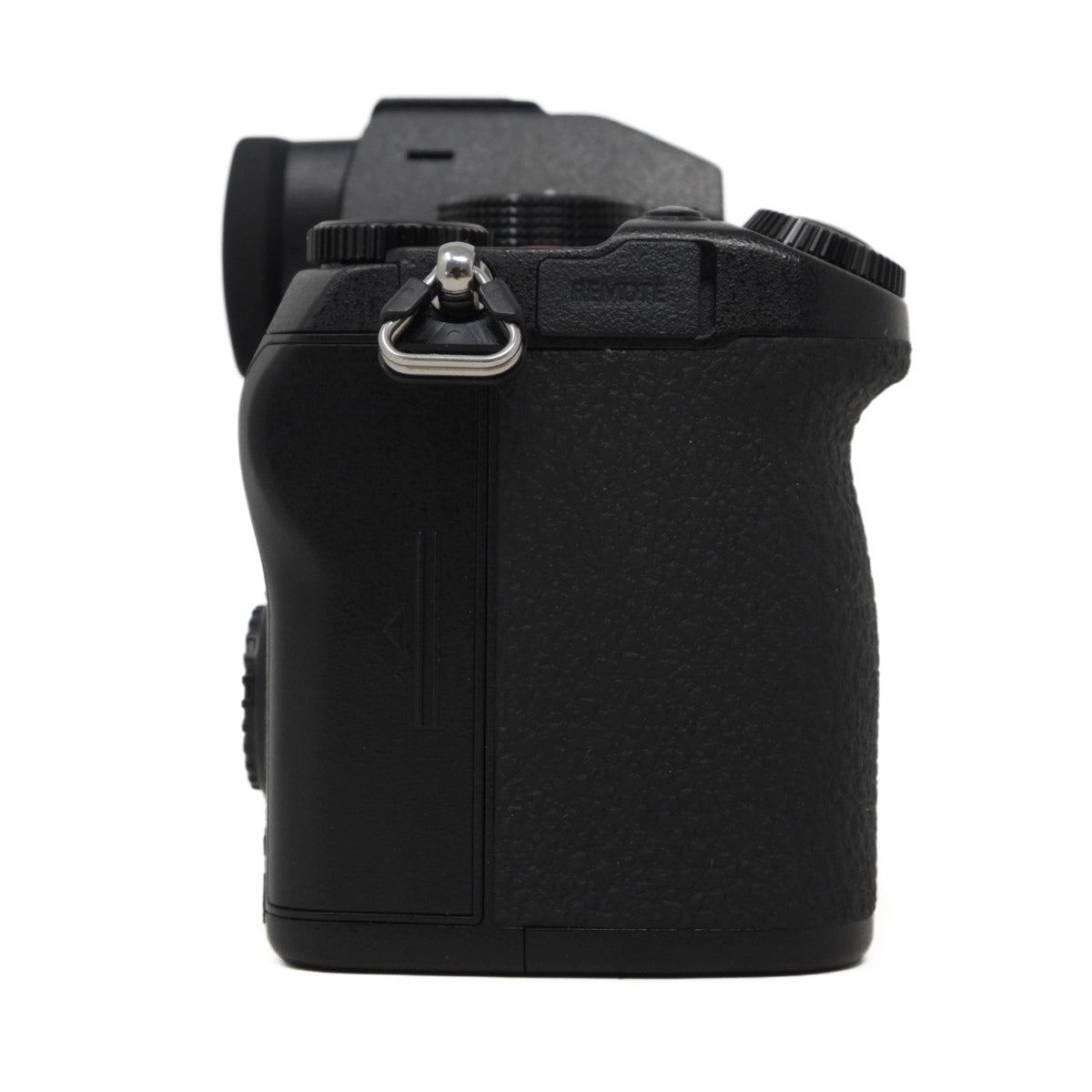 Black camera body with strap attachment on a white background