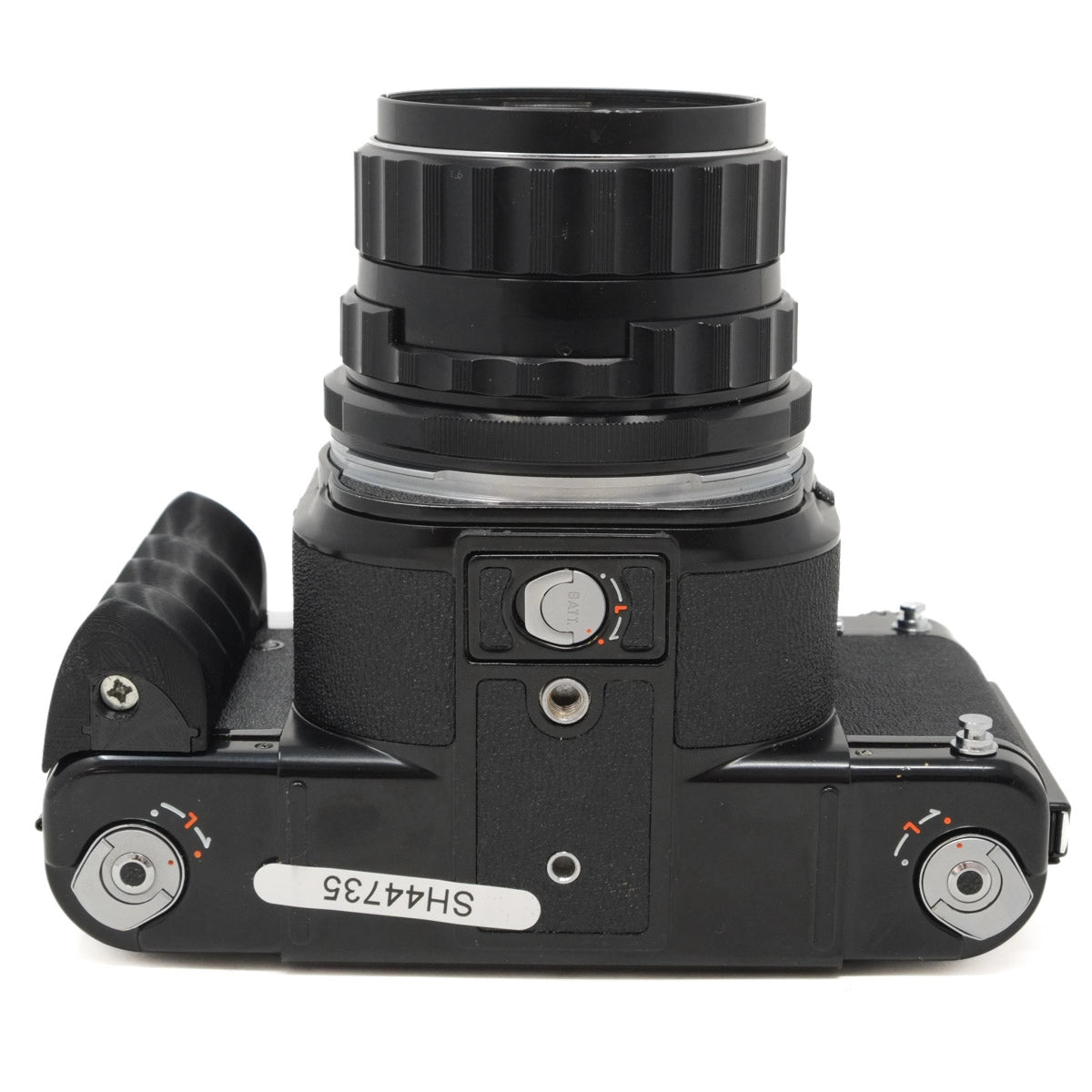 Black camera lens and body on a white background