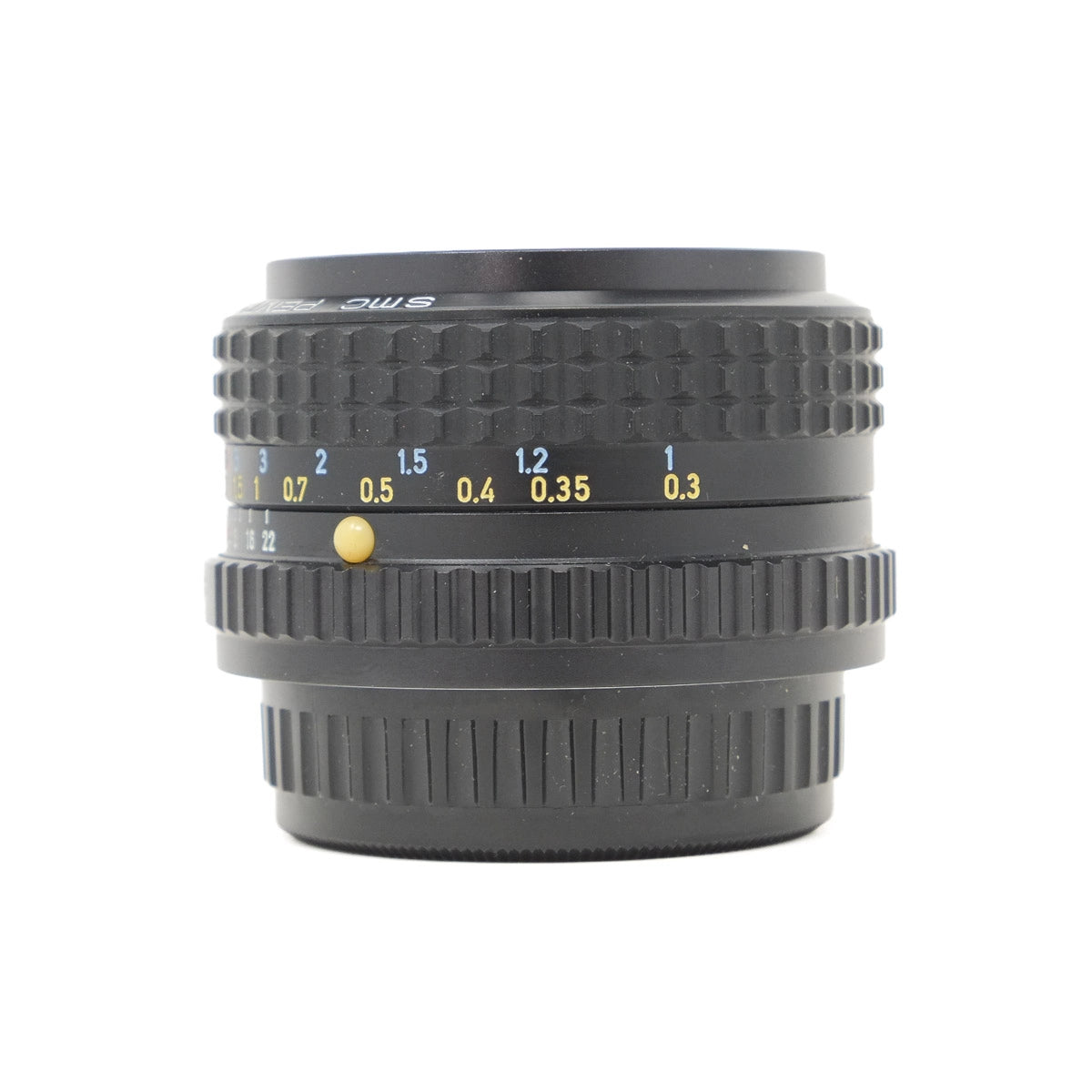 Camera lens with focus scale on a white background