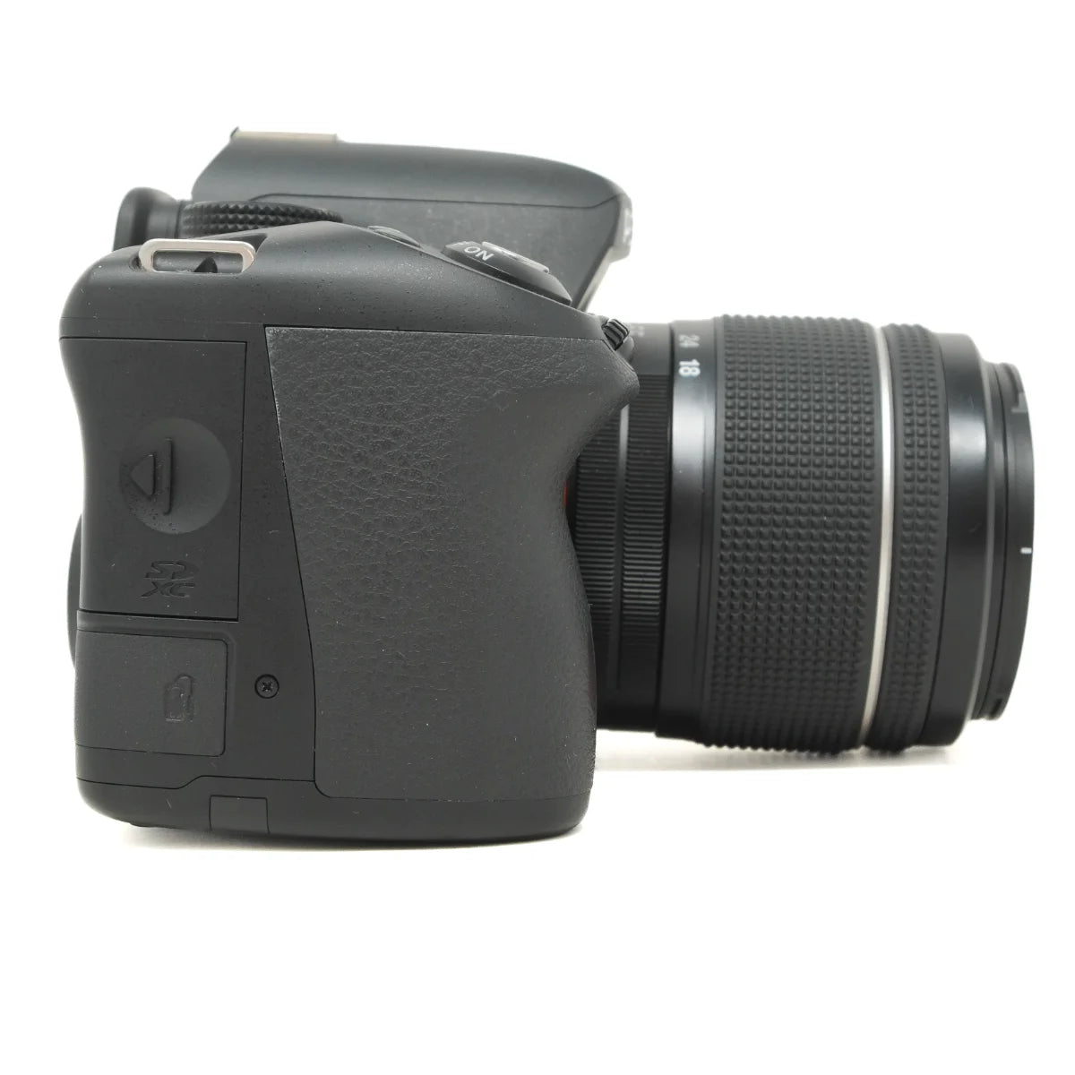 Used Pentax K-50 DSLR camera with Pentax 18-55mm WR Lens - side angle