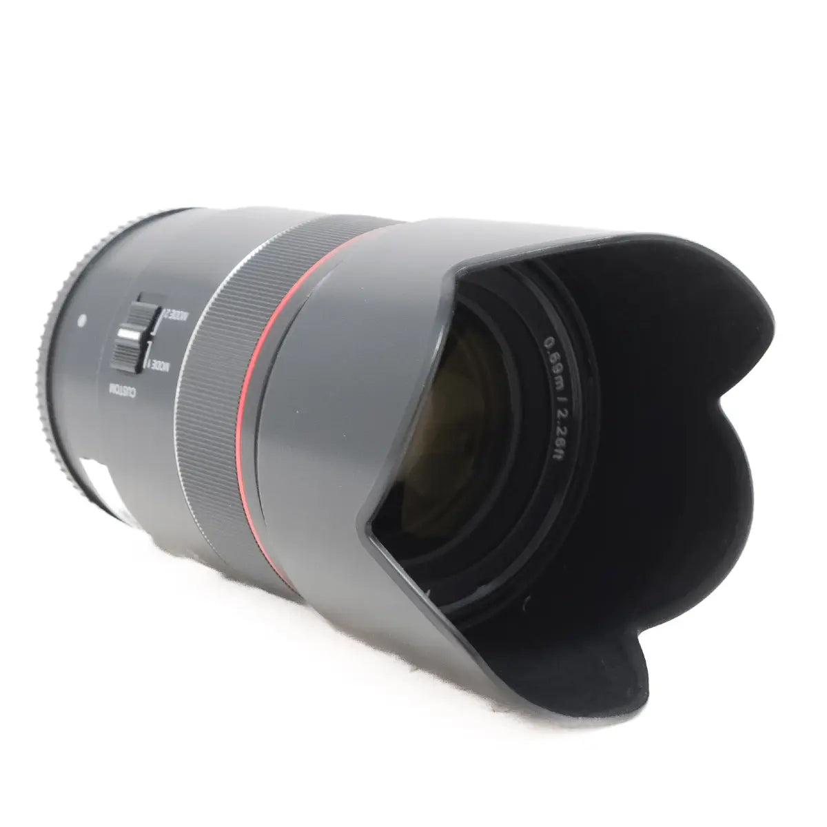 Camera lens with a lens hood on a white background