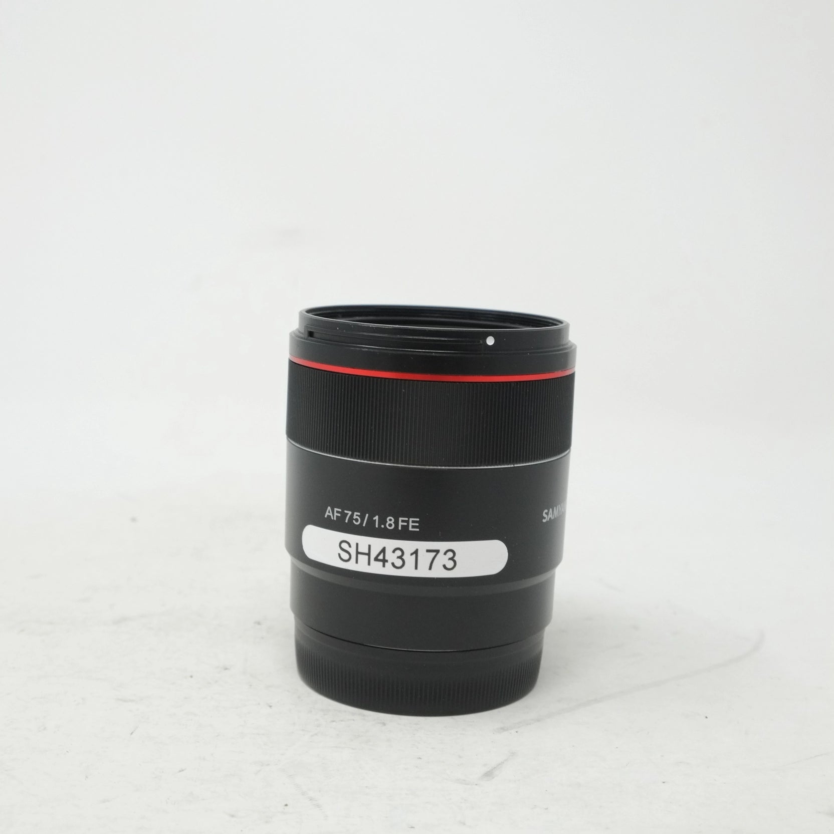 Camera lens with model number on a white background