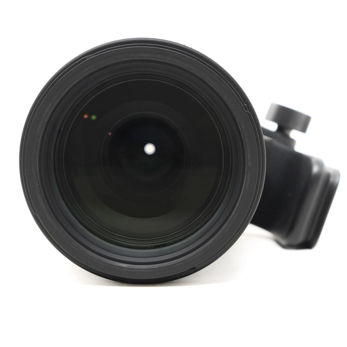 Black camera lens on a white background