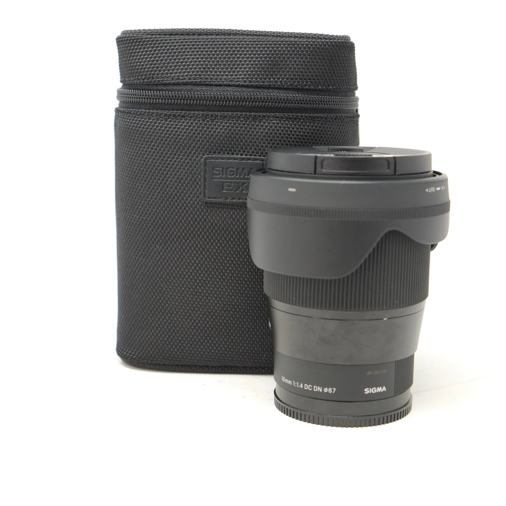 Sigma camera lens with a black carrying case on a white background