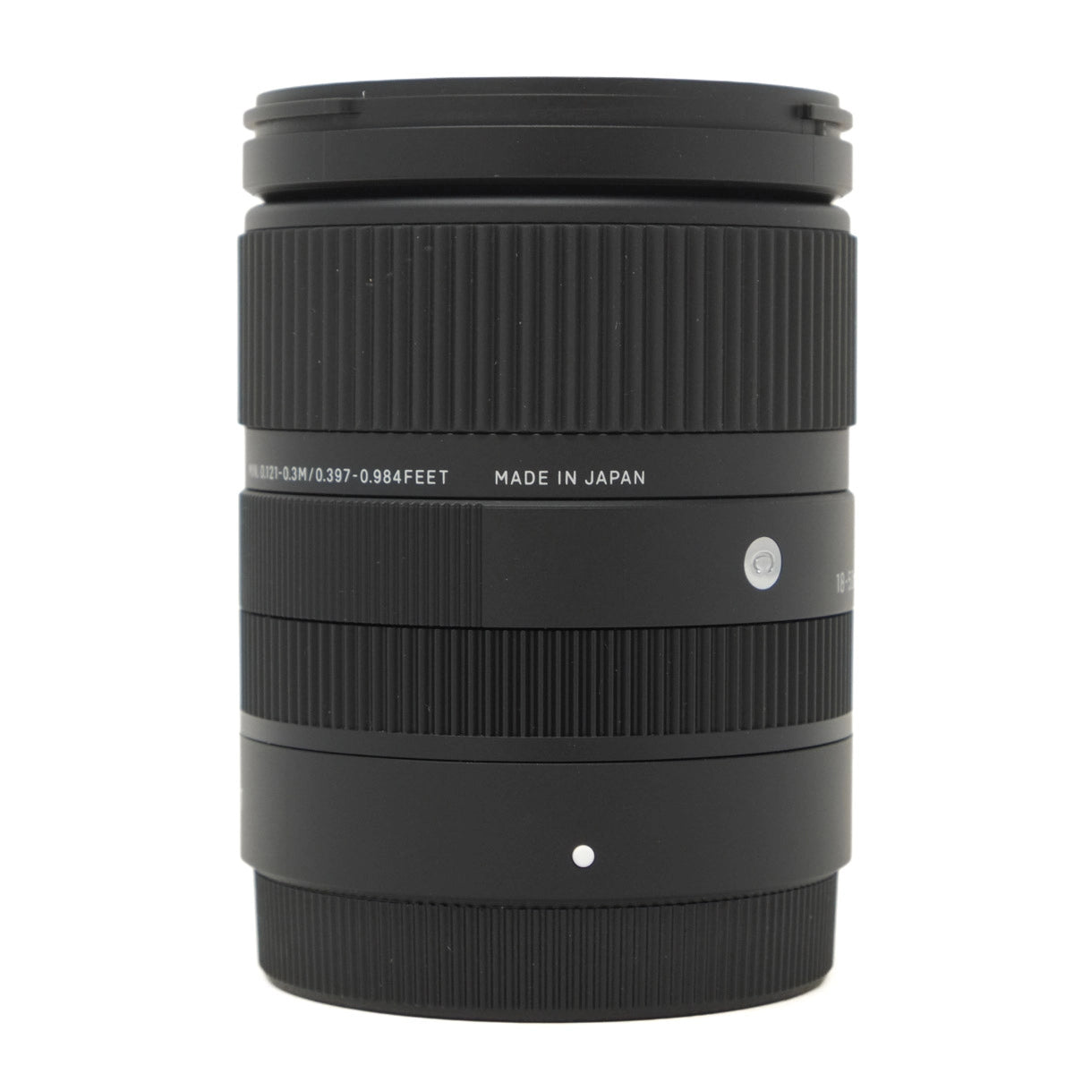 Camera lens with 'Made in Japan' text on a white background