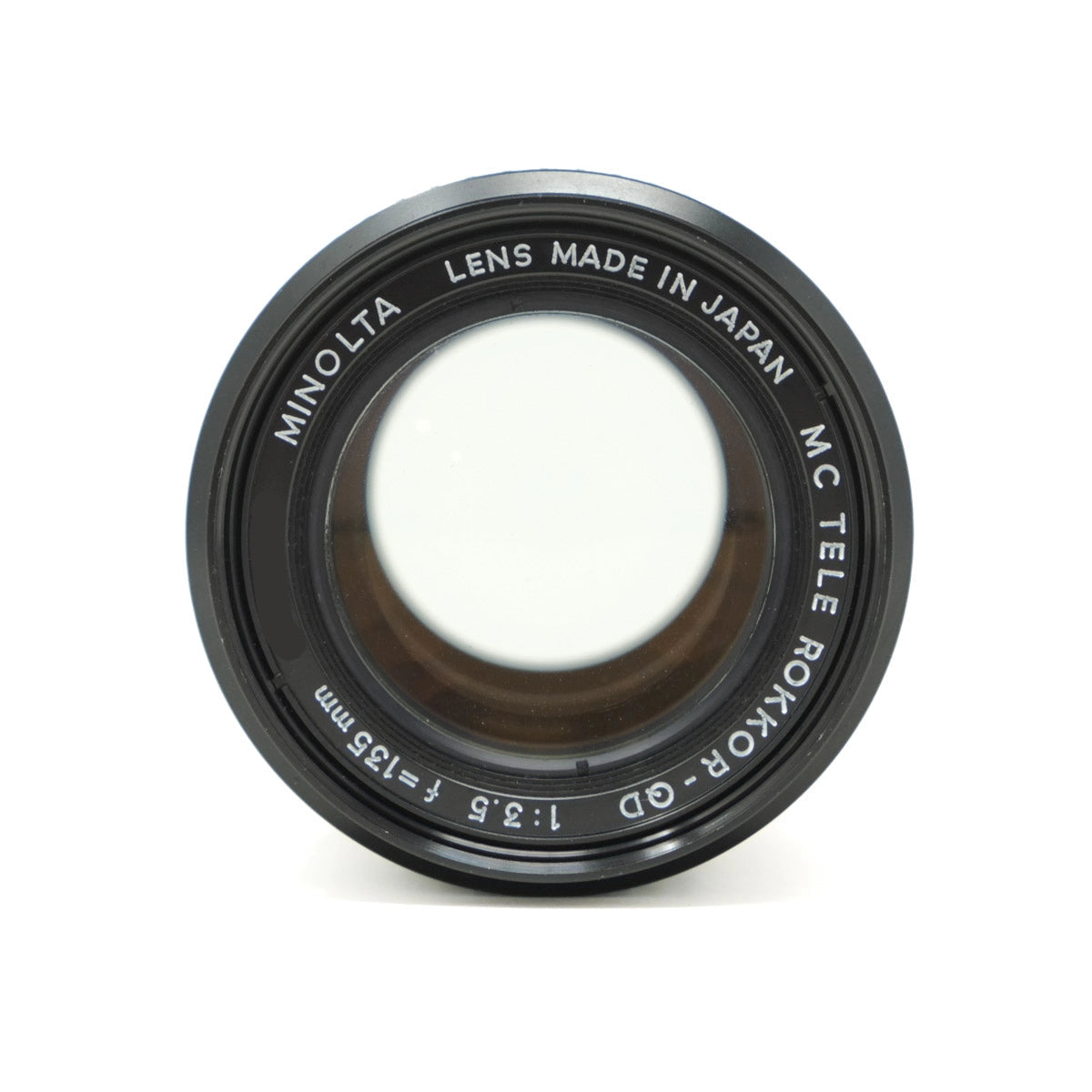Minolta camera lens with 'Made in Japan' text on a white background