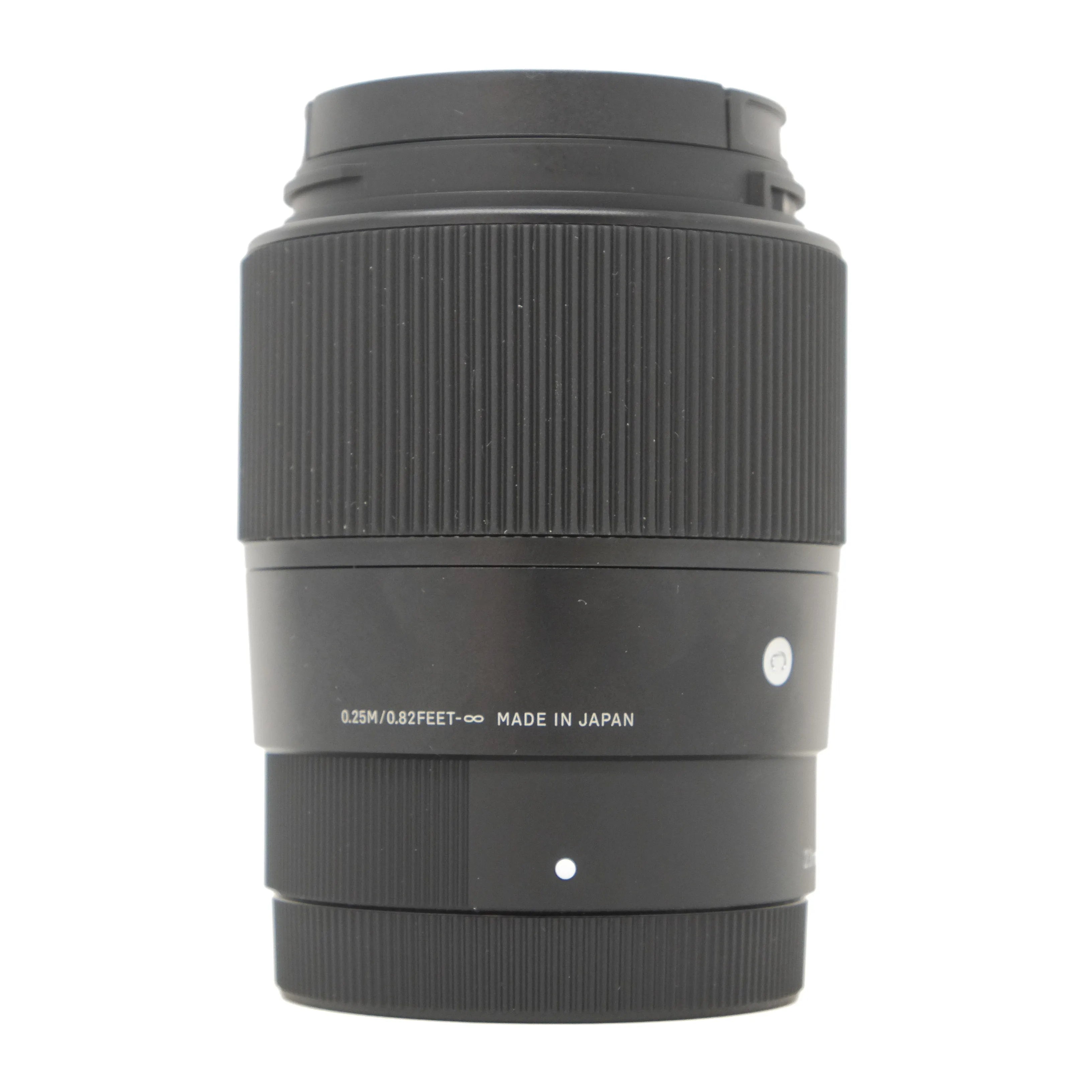 Black camera lens with 'Made in Japan' text on a white background