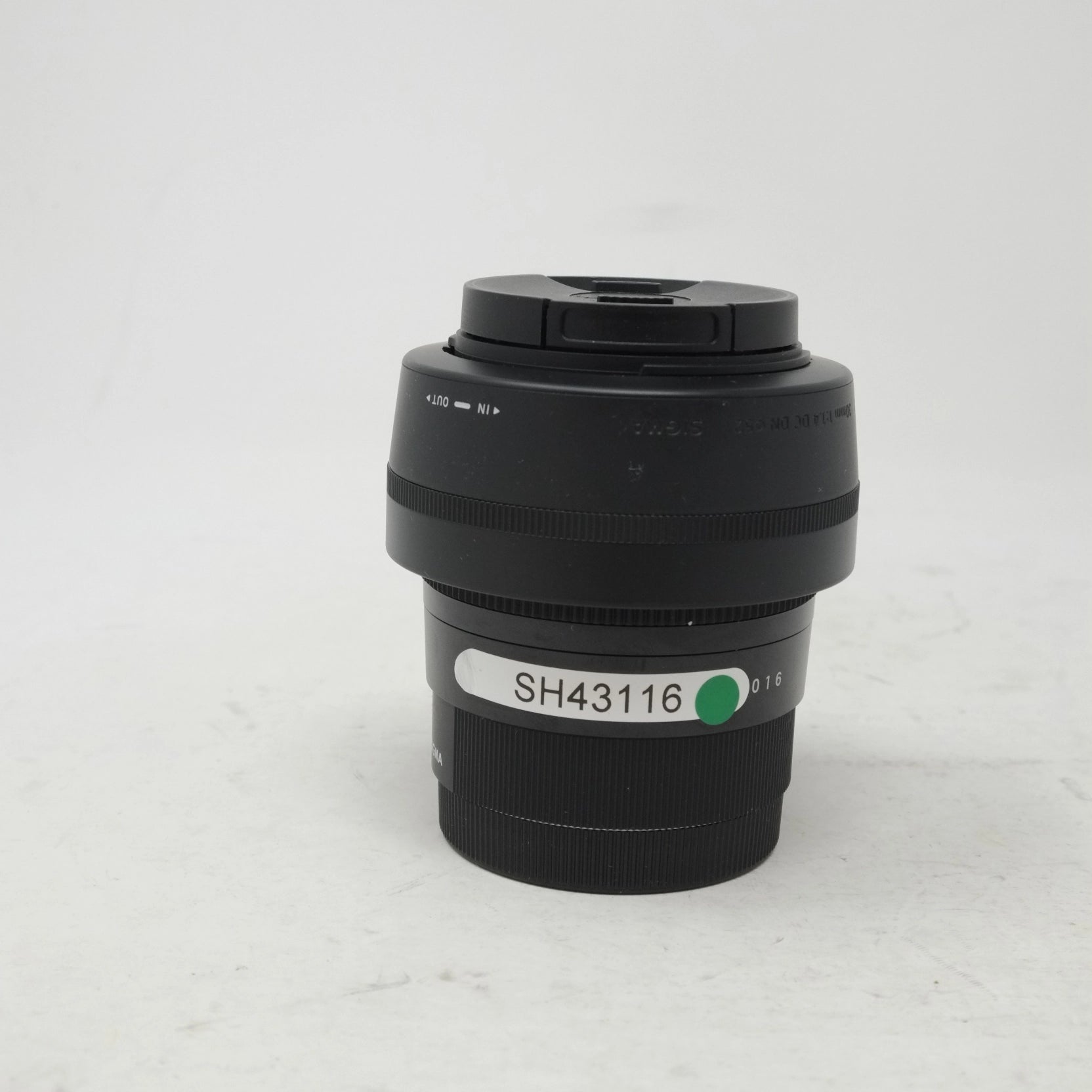 Camera lens with a visible model number on a white background