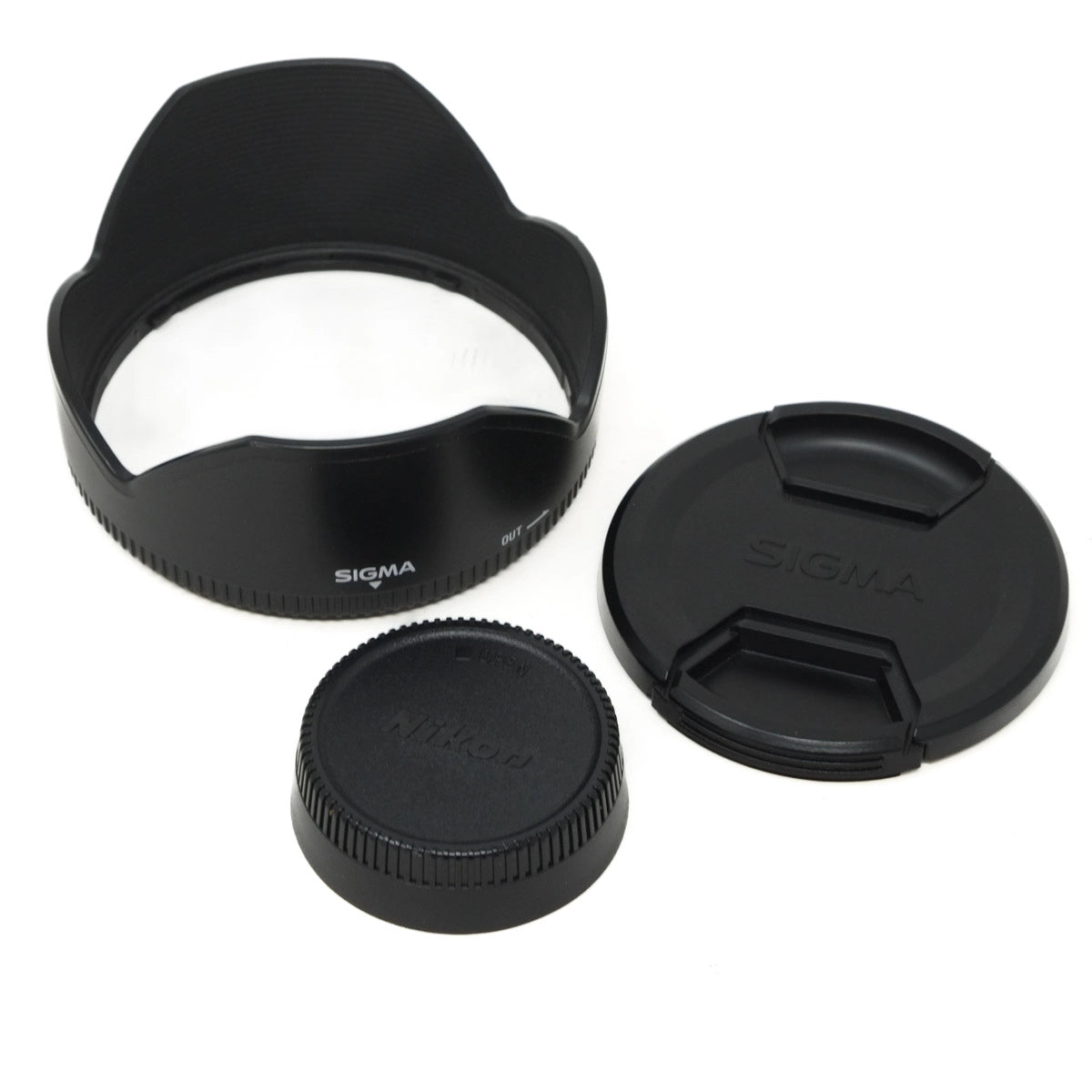 Sigma lens hood and caps on a white background