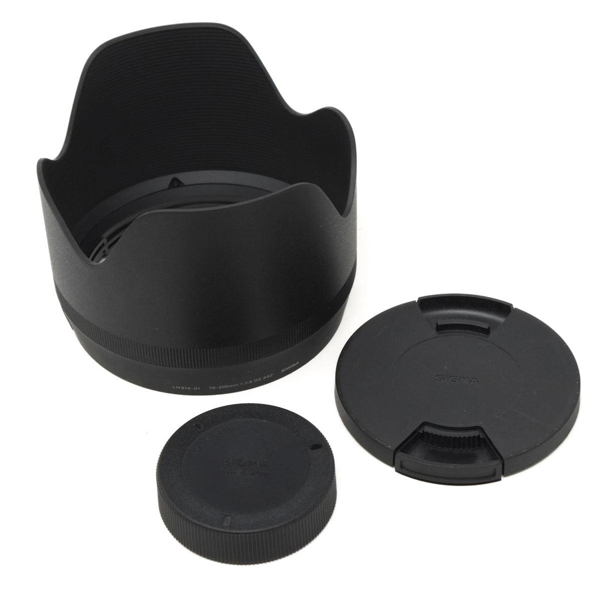 Set of black camera lens accessories on a white background