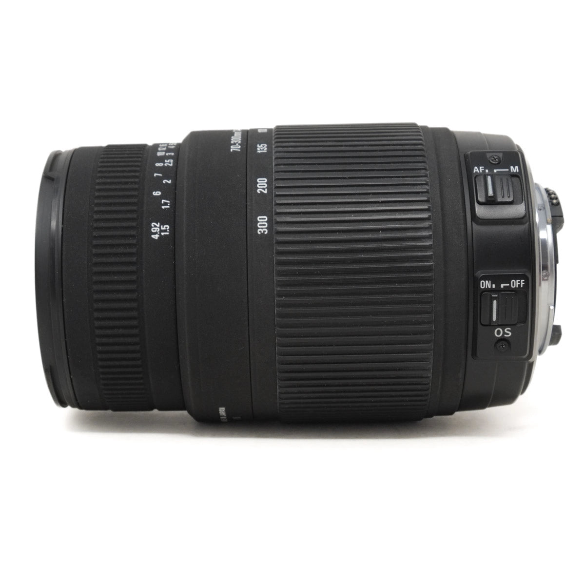 Camera lens with focus and mode dials on a white background