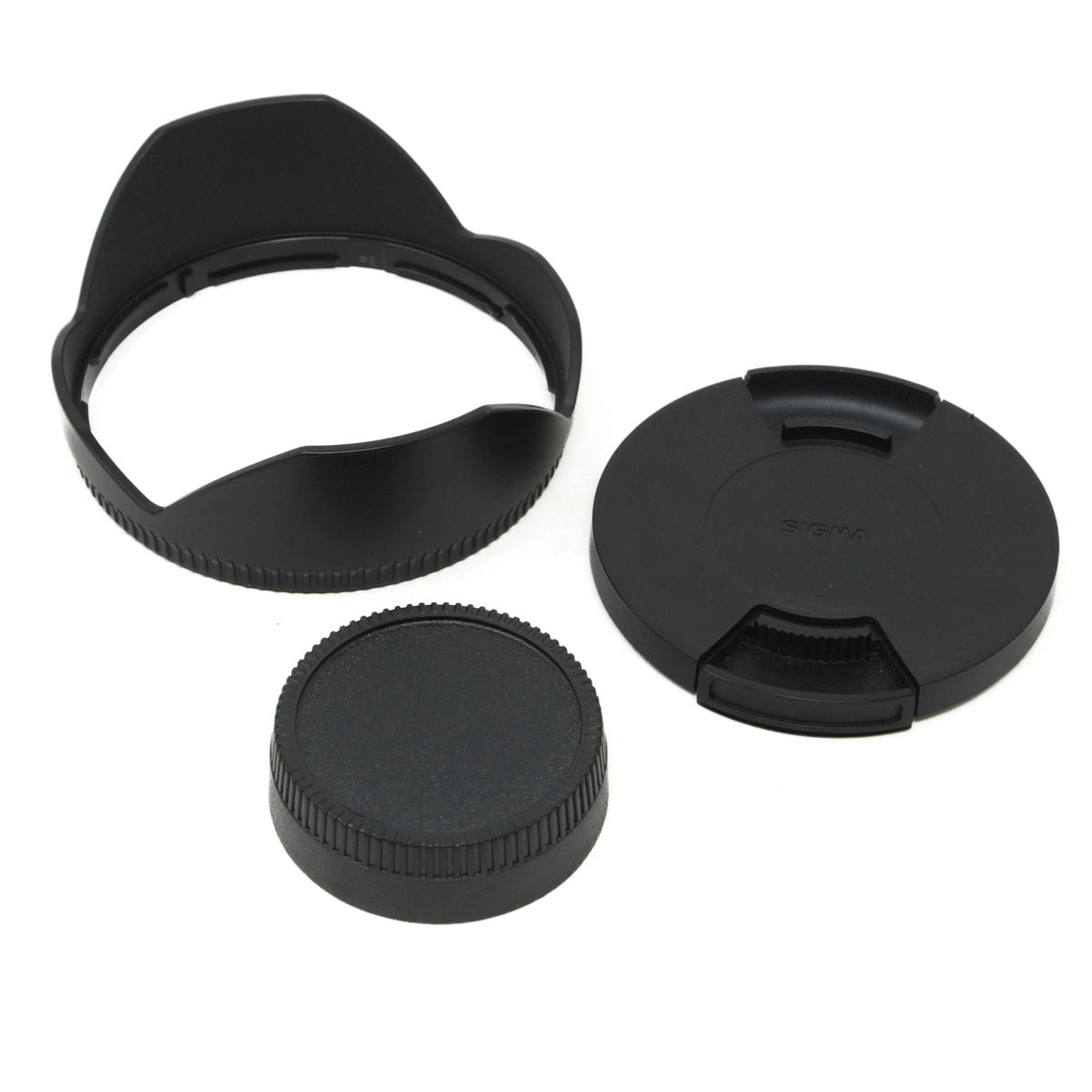 Set of black camera lens caps on a white background