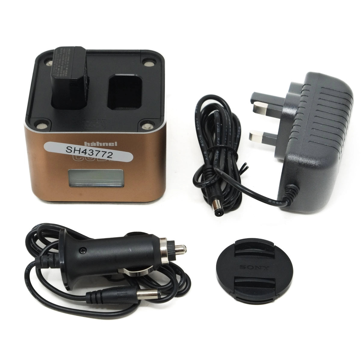 Collection of electronic accessories including a battery charger, power adapter, and car charger on a white background.
