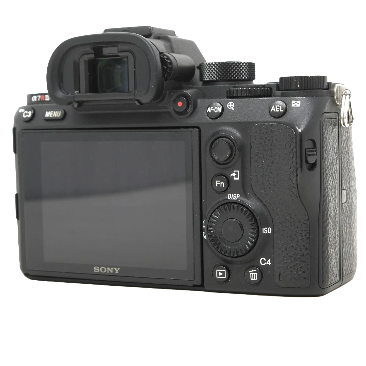 Sony mirrorless camera body rear view with LCD screen, dials, and controls on a white background.