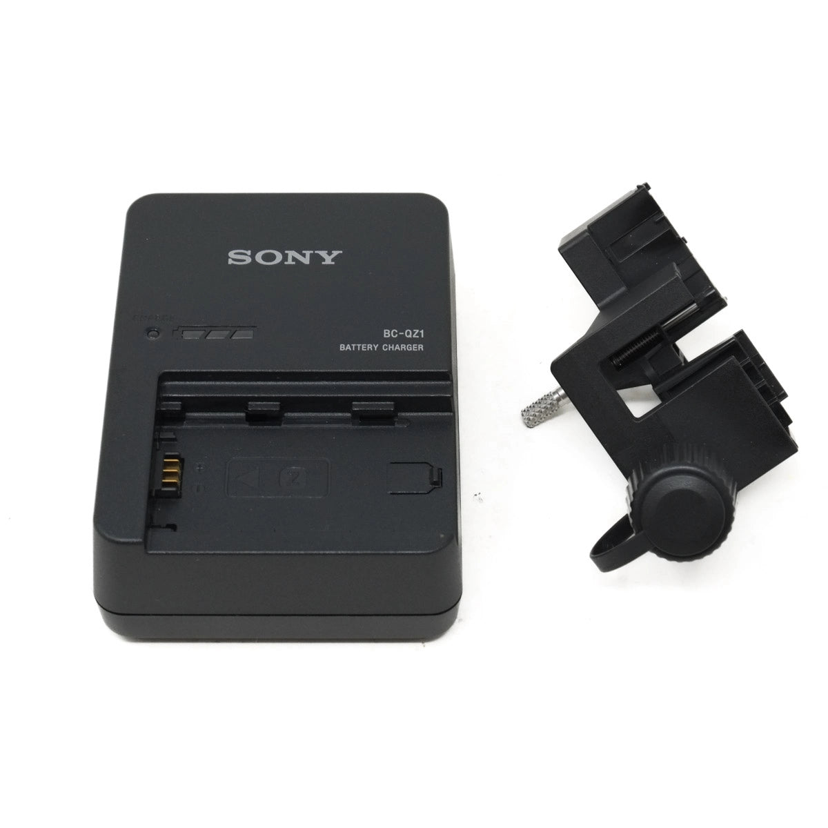 Sony battery charger and plastic device on a white background