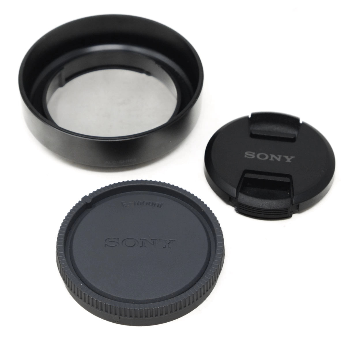 Sony camera lens accessories including a lens cap, front lens cover on a white background.