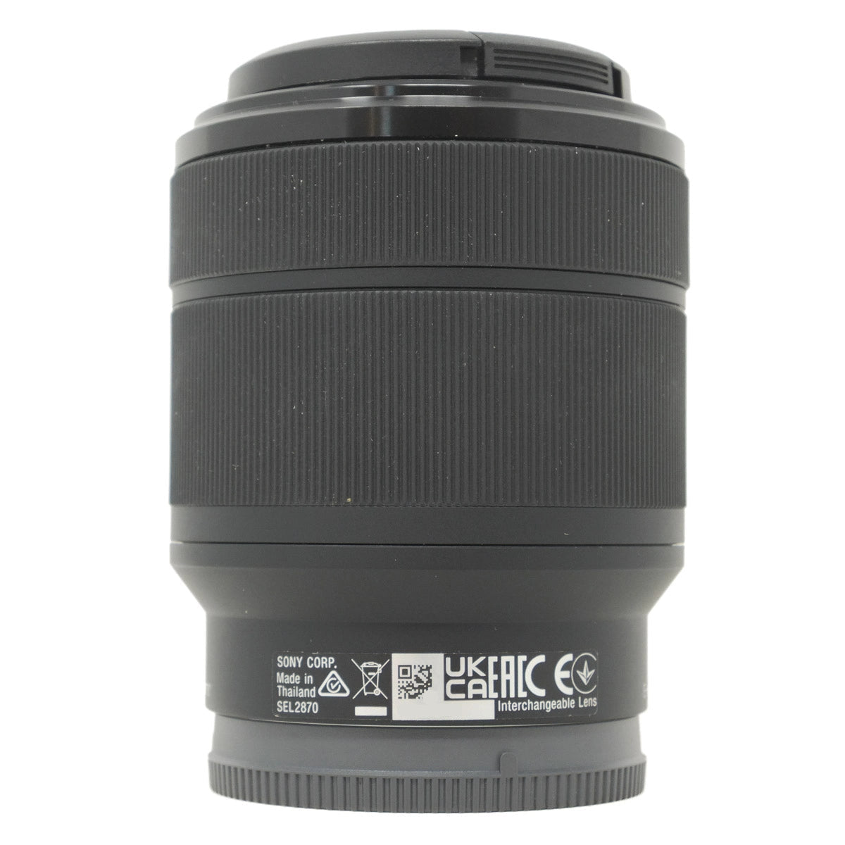 Black camera lens with branding and certification logos on a white background