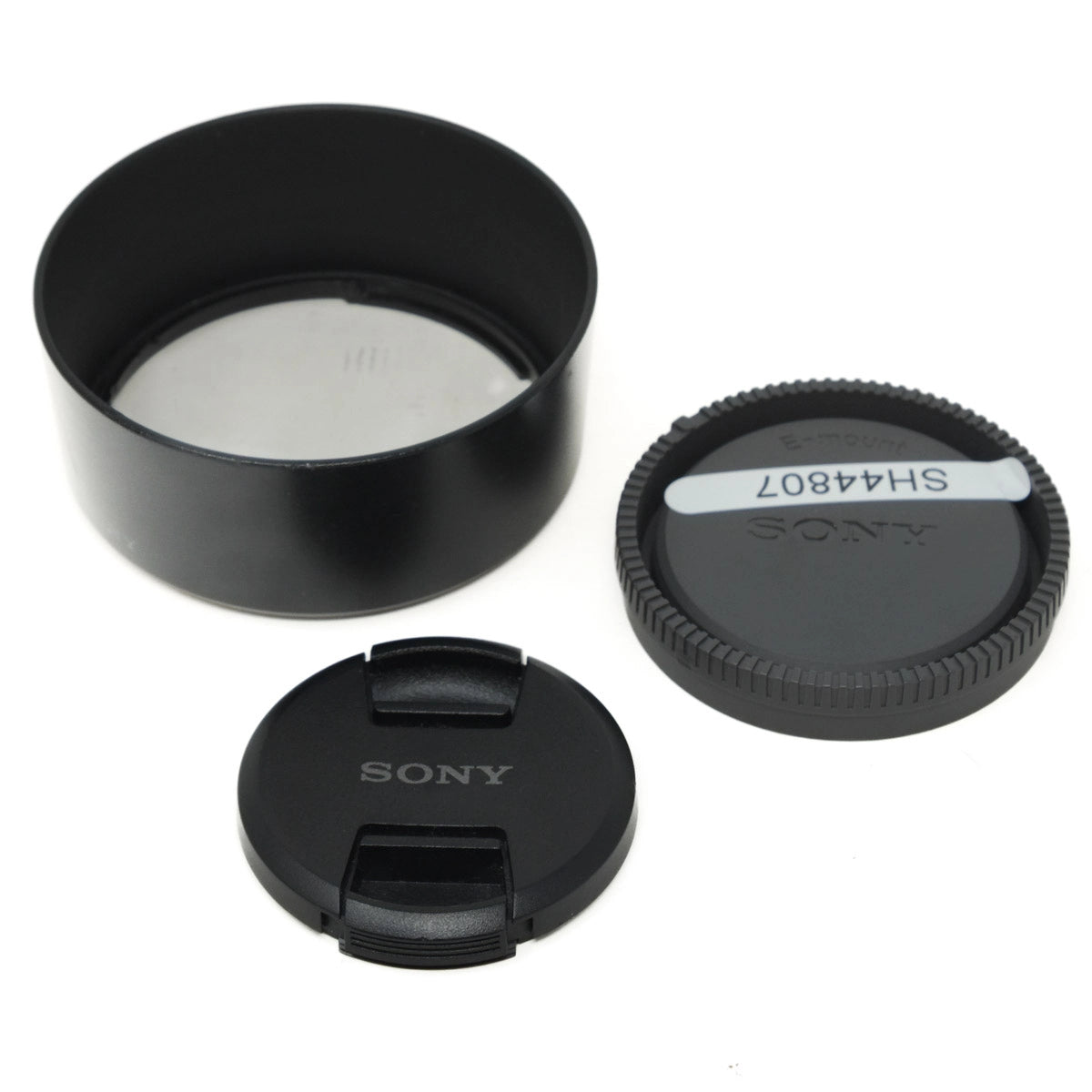 Sony camera lens components on a white background