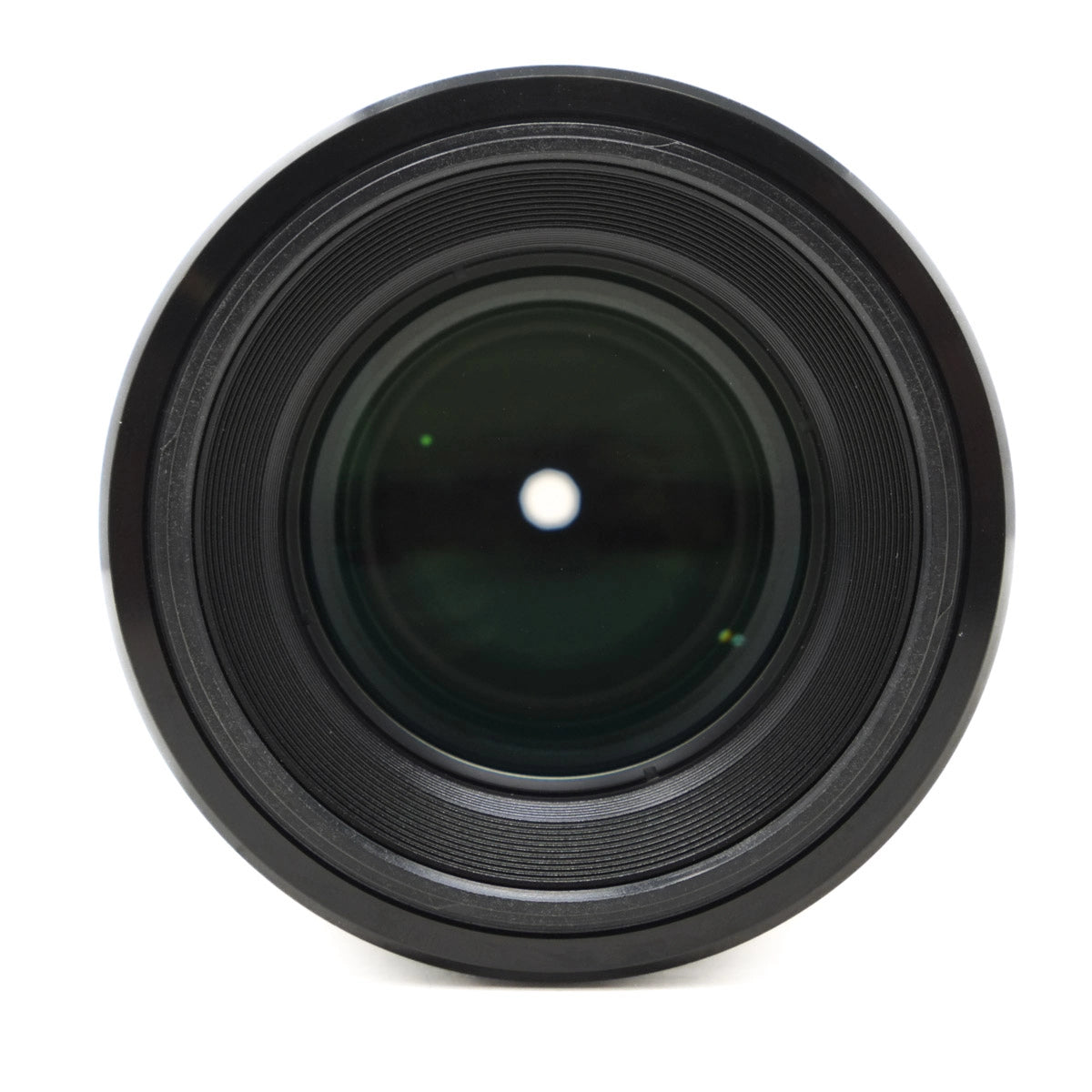 Black camera lens on a white background