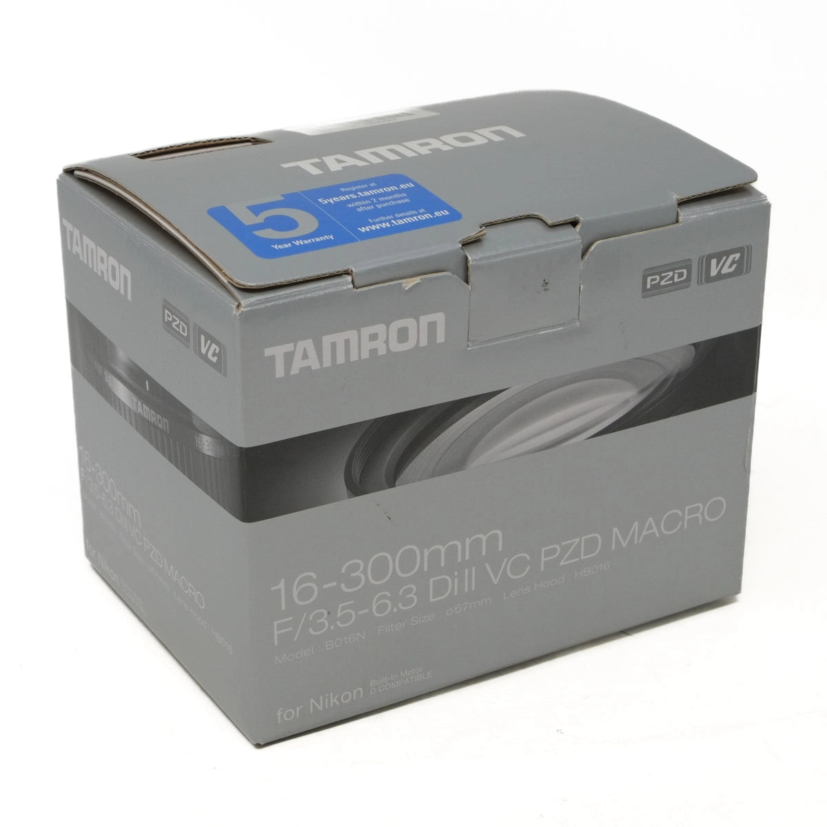 Tamron camera lens packaging box on a white background