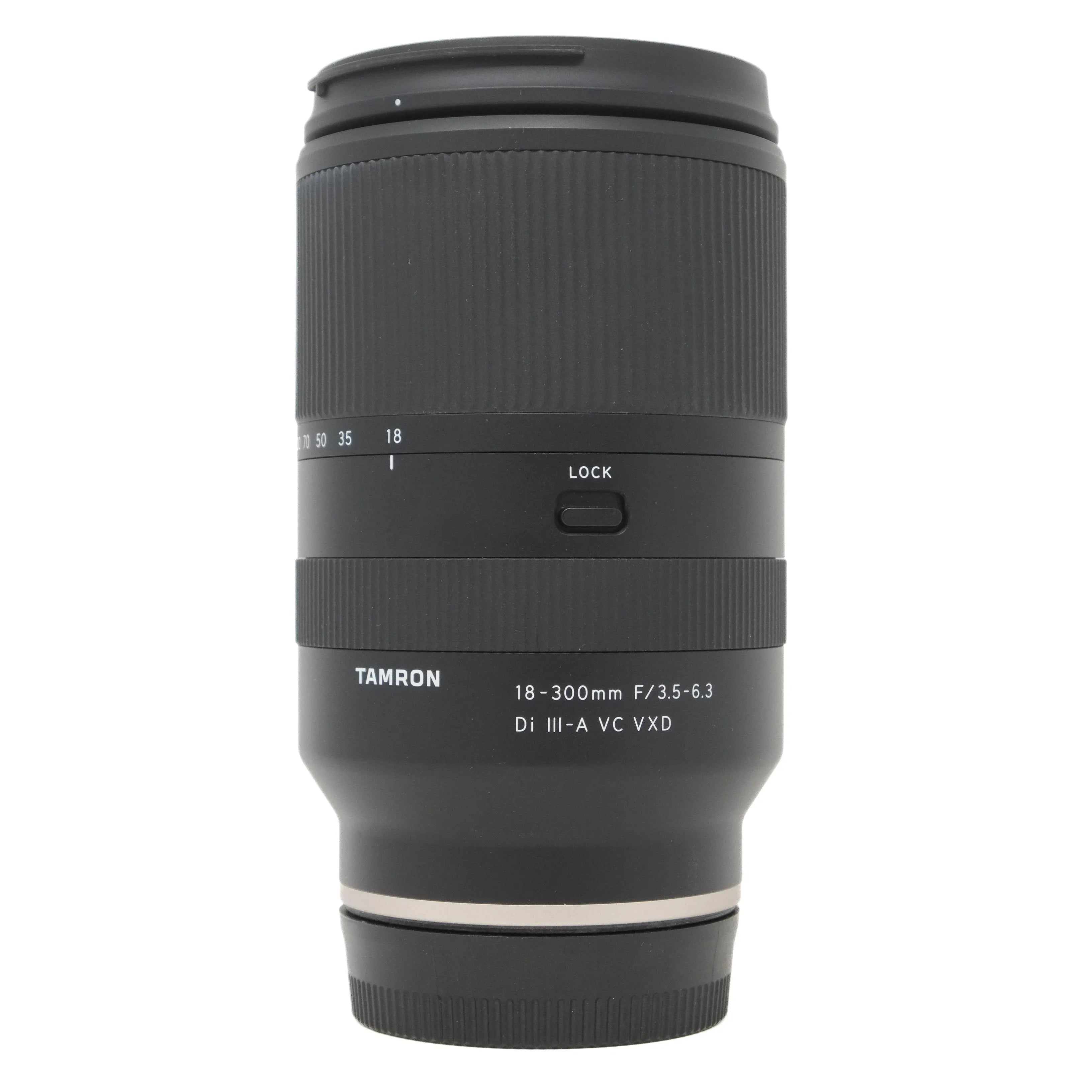 Black camera lens with Tamron branding on a white background