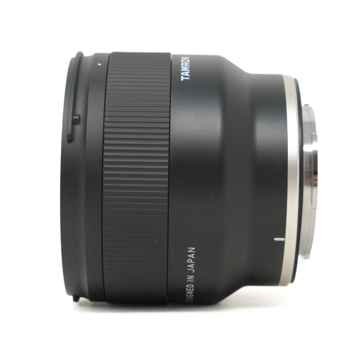 Camera lens with 'Tamron' branding on a white background