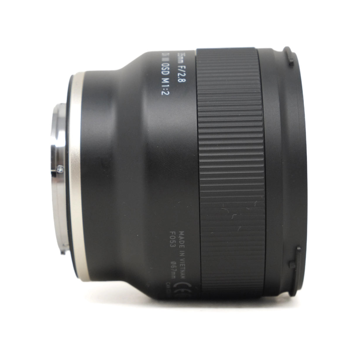 Black camera lens on a white background