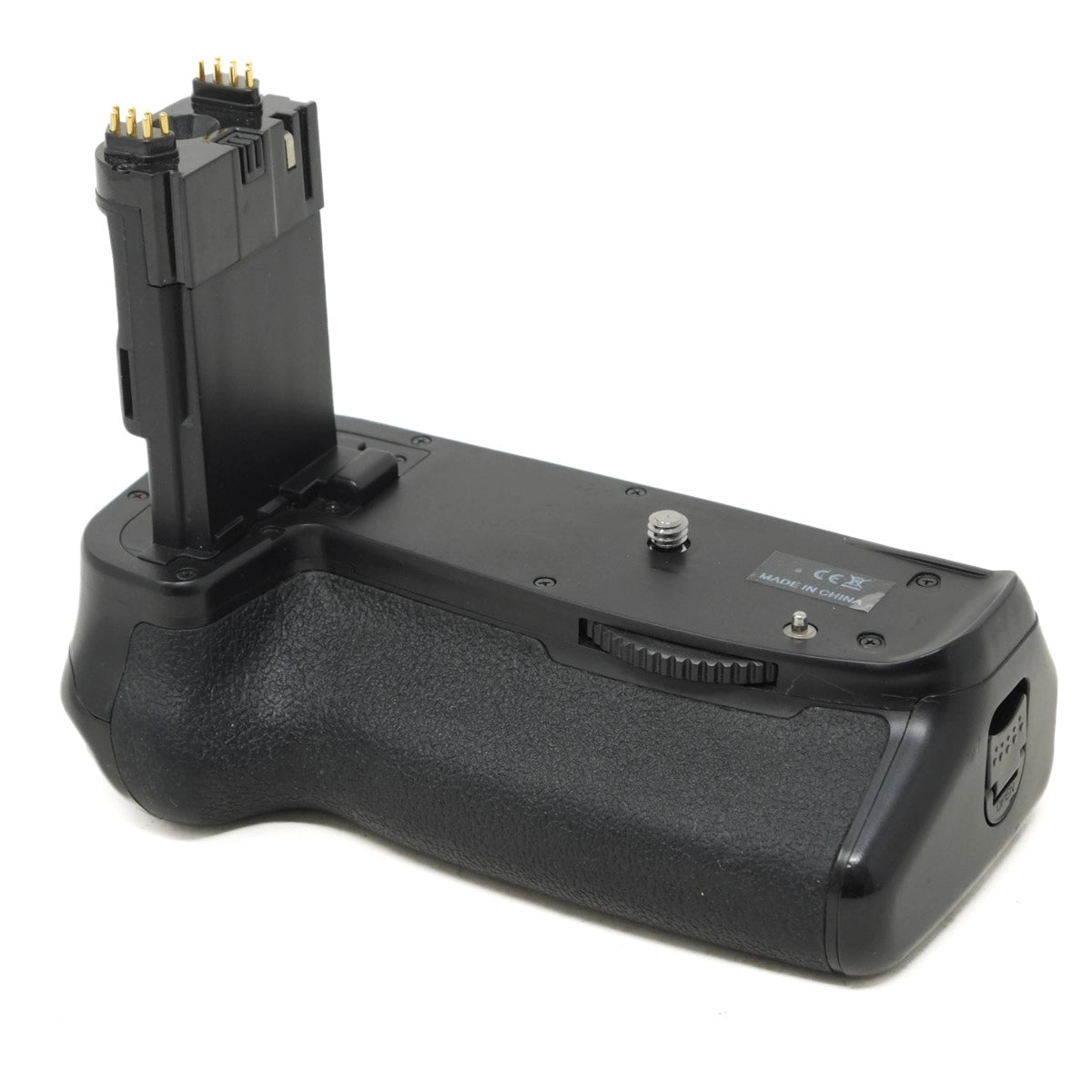 Black camera battery grip on a white background