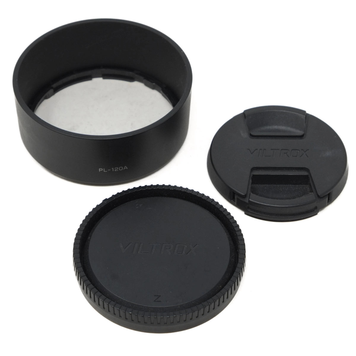 Camera lens accessories including a lens hood, front and rear covers on a white background