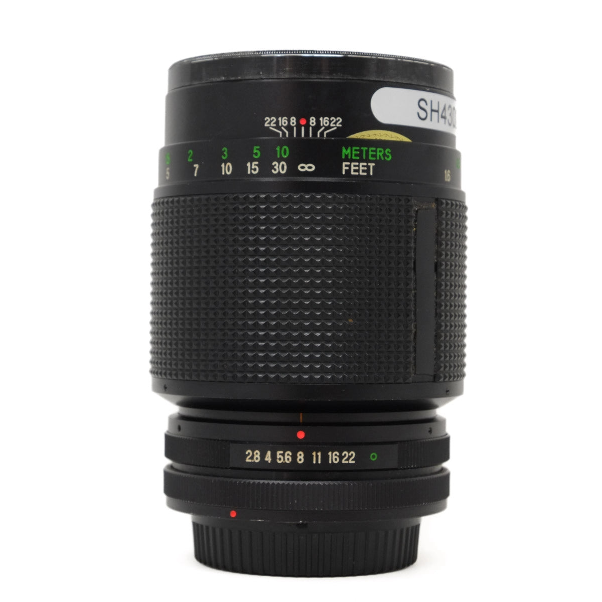 Camera lens with focus scale and measurement indicators on a white background