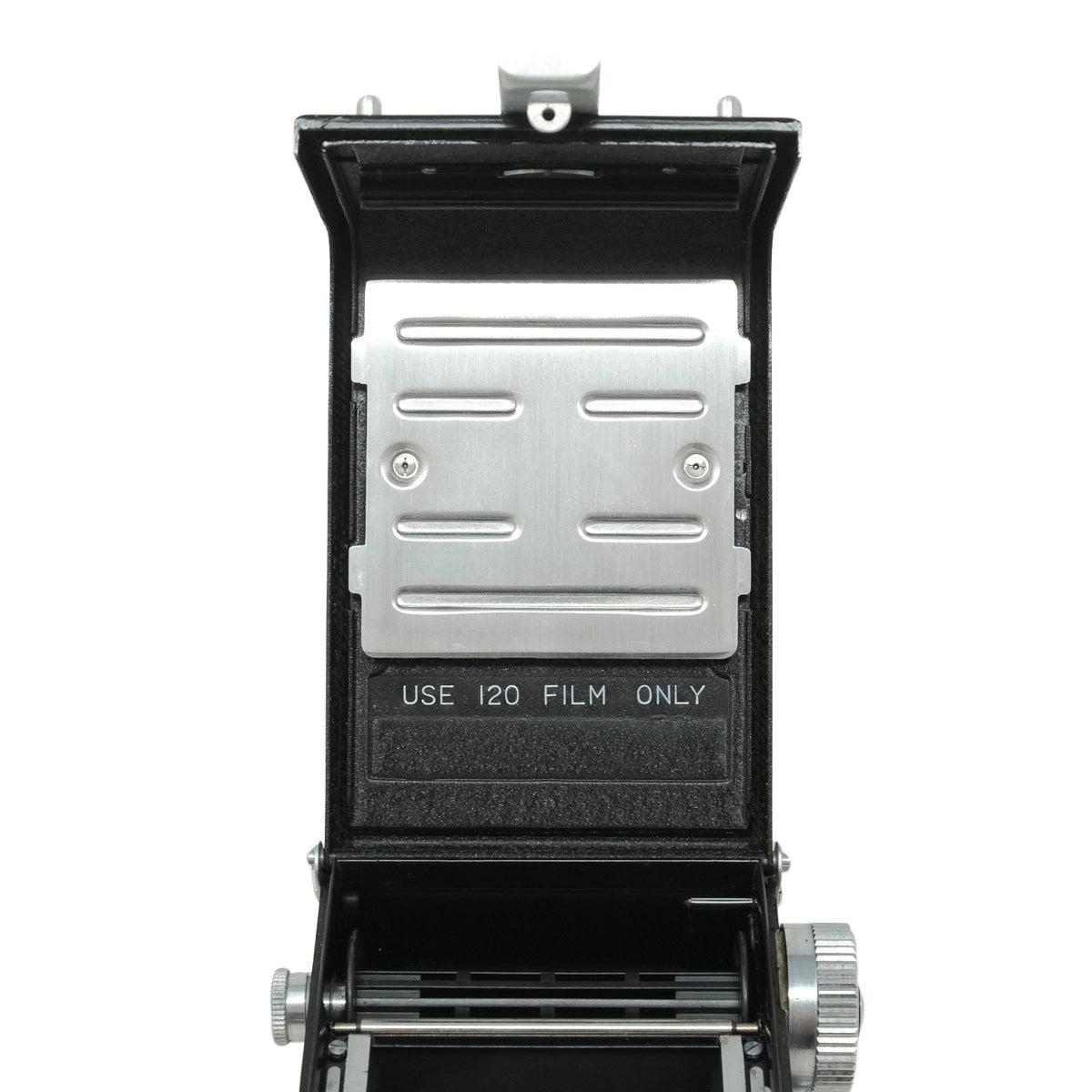 Vintage camera with open back showing film compartment on a white background