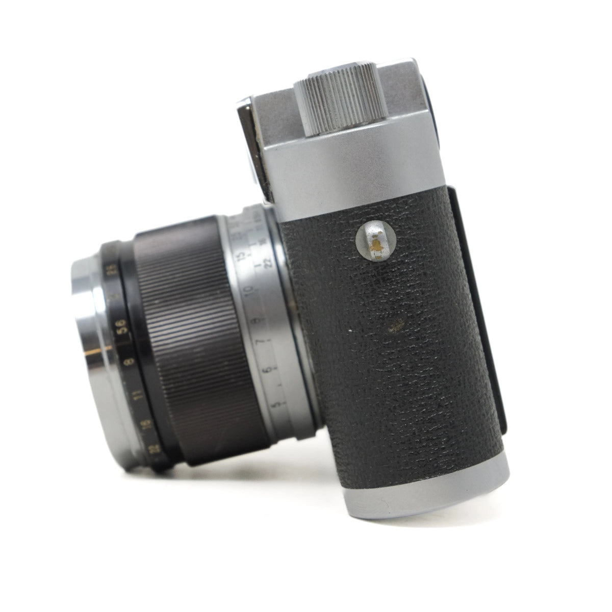 Vintage camera lens and body on a white background