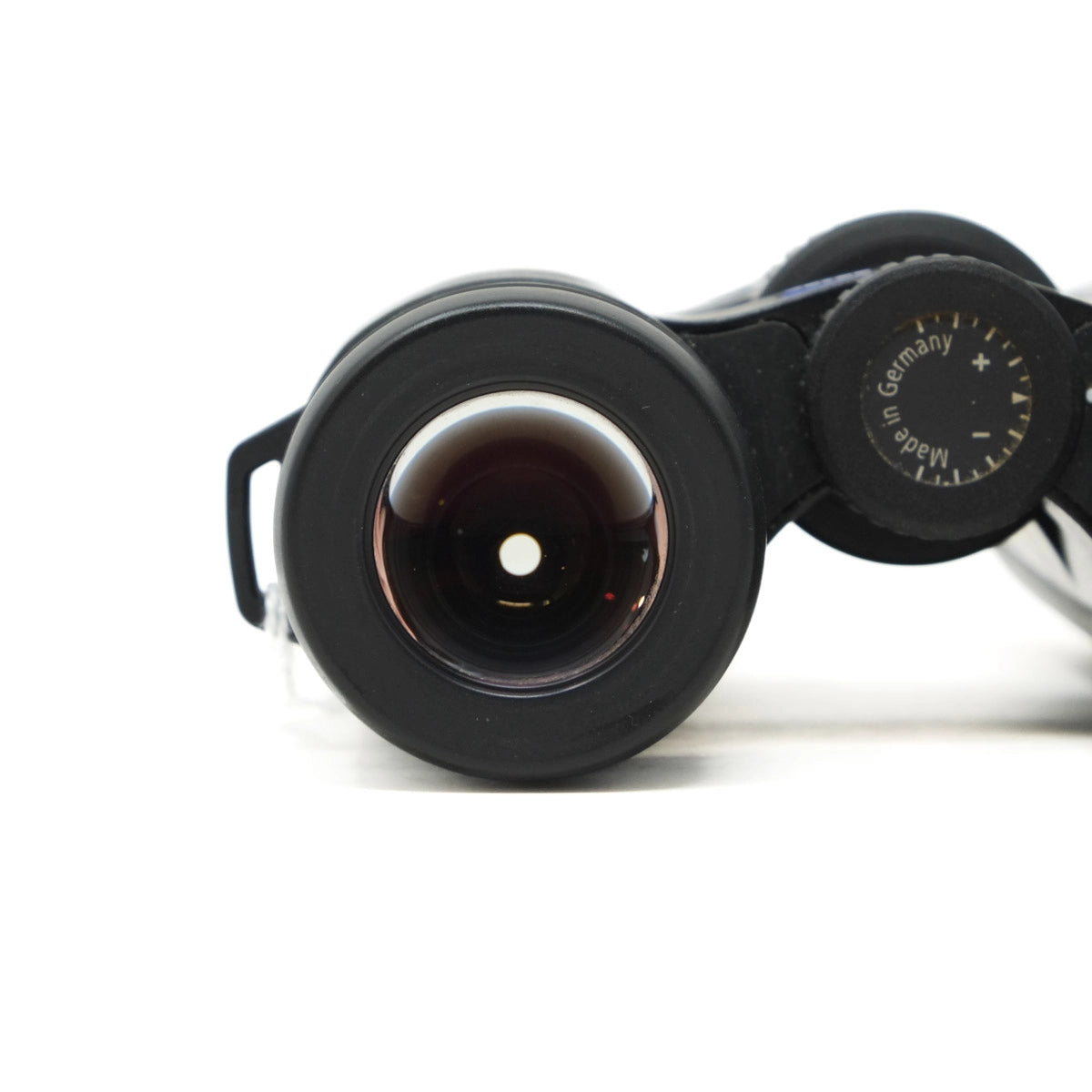 Vintage binoculars with 'Made in Germany' label on a white background