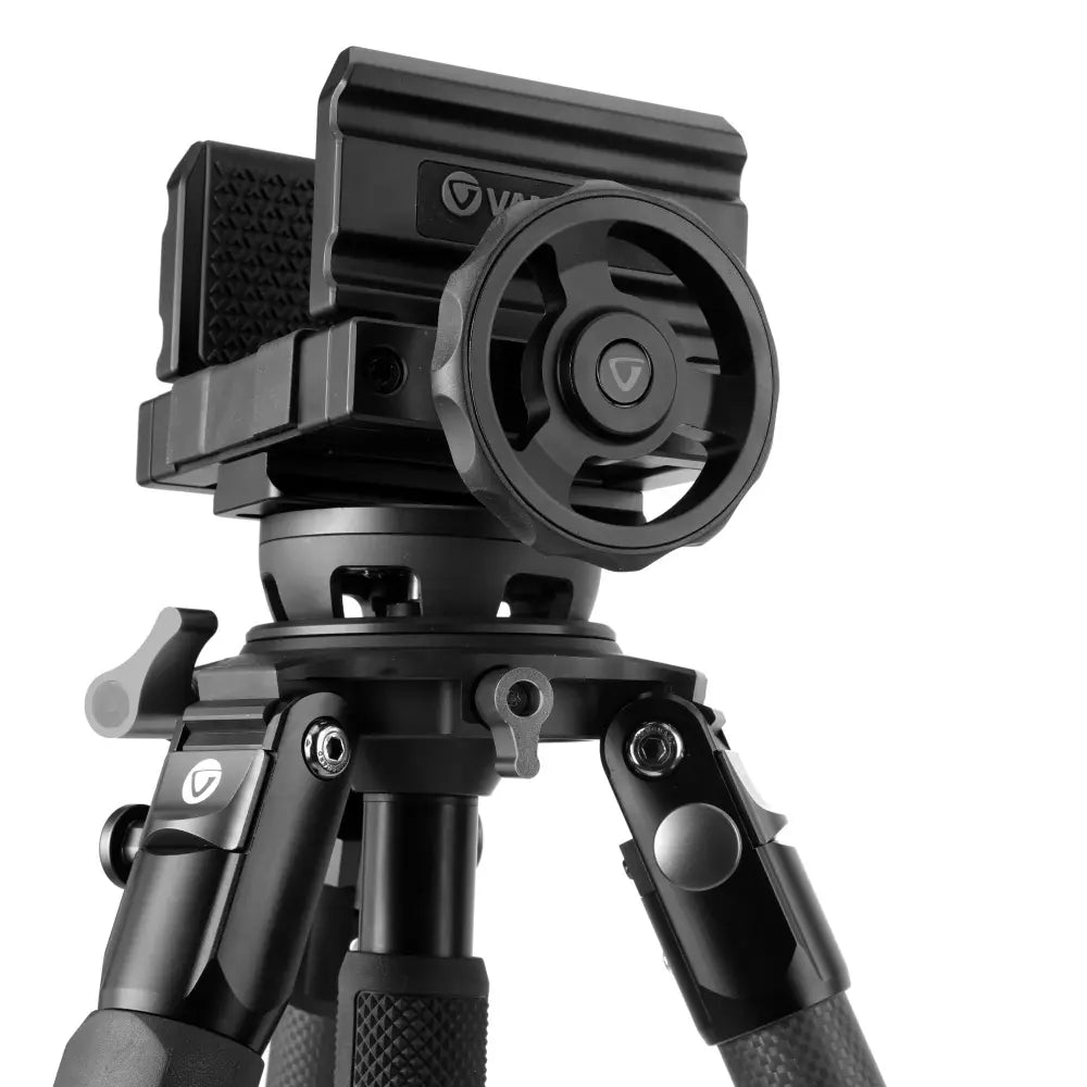 Black camera tripod with a smartphone mount on a white background