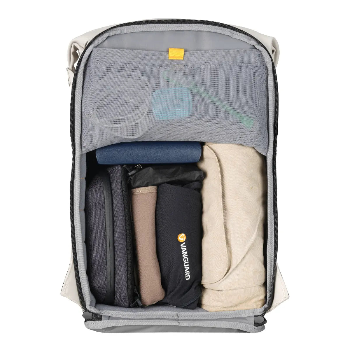 Open travel backpack with clothes and a visible brand logo on a white background