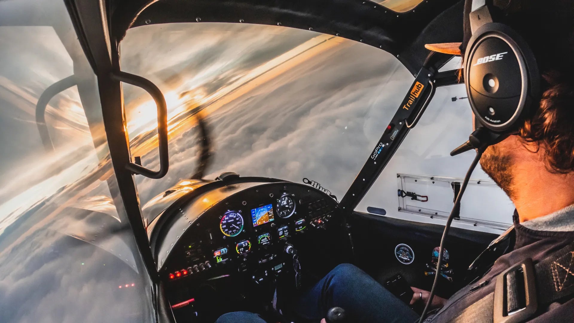 Suction cup example photo taken from the cockpit of a light aircraft flying at sunset above the clouds