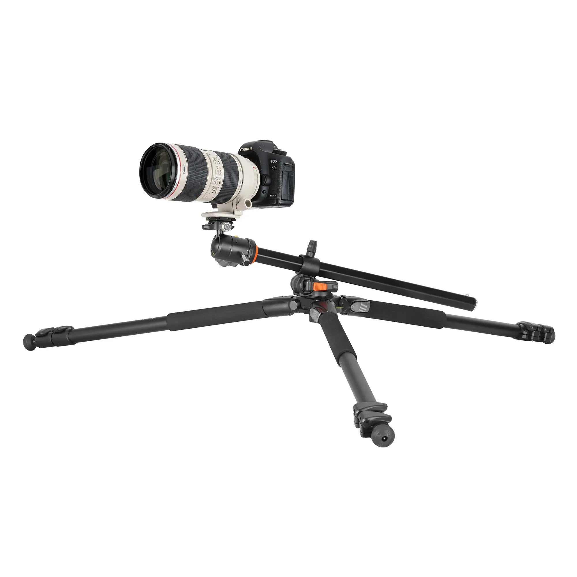 Camera with a large lens on a tripod against a white background