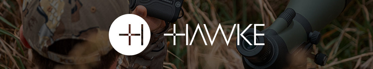 Hawke spotting scopes collection banner image - A person in the field using a spotting scope and rangefinder whilst observing nature