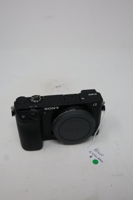 Used Sony A6000 digital camera body with leather case and 3 batteries