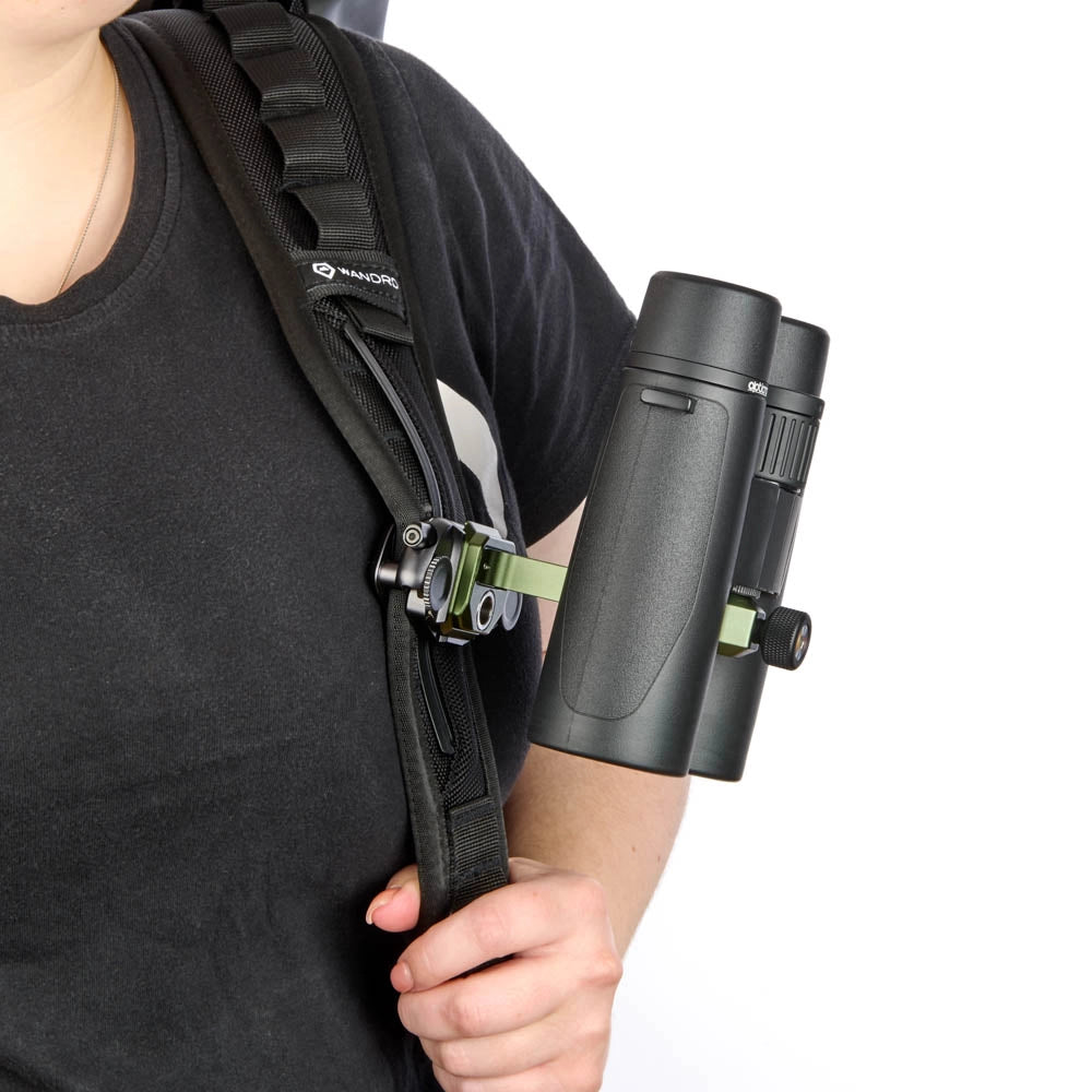 3 Legged Thing Binoz Binocular Mount Green with binoculars attached on camera bag